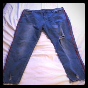 Blue ripped jeans plus red stripe
